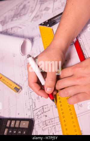 business, architecture, building, construction and people concept ,close up of architect hands with plan Stock Photo