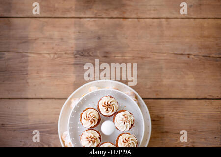 Close up, cupcakes with vanilla cream. Studio shot. Stock Photo