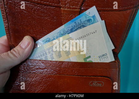 Euro and pounds sterling banknotes in wallet, London Stock Photo