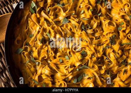 Homemade Autumn Pasta with Pumpkin Sauce and Sage Stock Photo