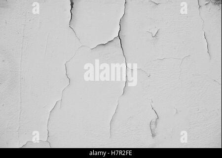 White Grunge background cracked plaster wall on house Stock Photo