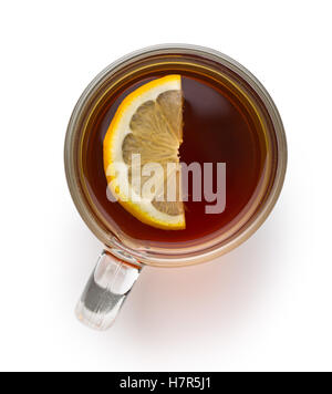 Tea in glass cup with sliced lemon isolated on white background. Top view. Stock Photo