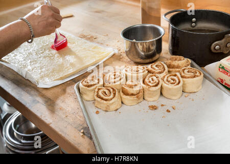 Making cinnamon rolls, Squam Lake Inn and Marketplace, NH Stock Photo
