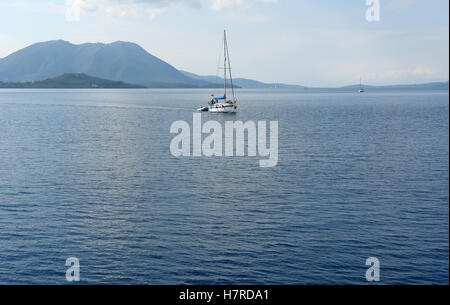 Lefkada, GREECE, May 11, 2013: Panoramic view with green islands, mountains and yacht in Ionian sea, Greece. Stock Photo