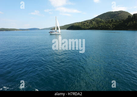 Lefkada, GREECE, May 11, 2013: Panoramic view with green islands, mountains and yacht in Ionian sea, Greece. Stock Photo