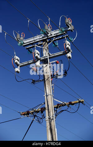 high voltage power cables pole with insulators Stock Photo