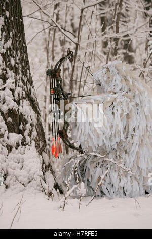 Bowhunter In Snow Ghillie Suit Stock Photo