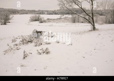 Bowhunter In Snow Ghillie Suit Stock Photo