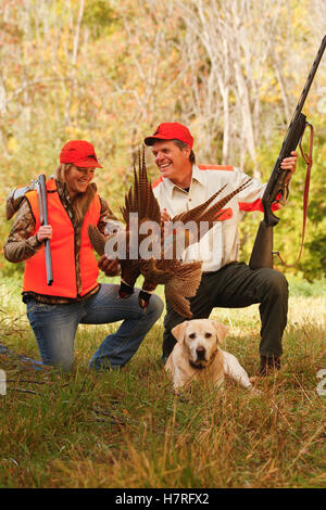 Father And Daughter Pheasant Hunters With Lab Stock Photo
