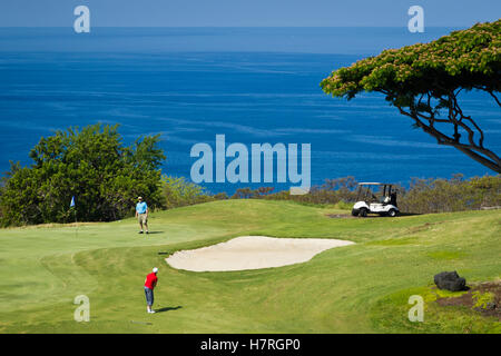 Golfers on golf course, Kona Country Club; Kailua Kona, Island of Hawaii, Hawaii, United States of America Stock Photo