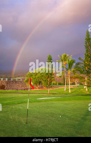 Rainbow over a golf course, Kona Country Club; Kailua-Kona, Island of Hawaii, Hawaii, United States of America Stock Photo