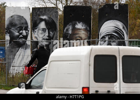 The painted fragments of the former Berlin wall, photographed in Teltow, Germany, 7 November 2016. Some of the fragments are for sale and painted with portraits of famous politicians and activists, such as Nelson Mandela (R-L), Aung San Suu Kyi, Mahatma Gandhi and the Dalai Lama. The wall fell in Berlin on the 9 November 27 years ago.    PHoto: Ralf Hirschberger/dpa Stock Photo