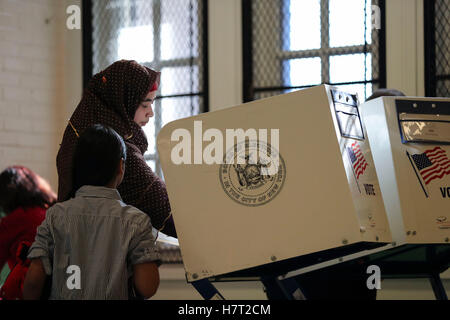 New York, USA. 8th Nov, 2016. A voter fills her ballot at a polling station in Queens, New York, the United States, Nov. 8, 2016. The U.S. presidential elections kicked off on Tuesday. Credit:  Wang Ying/Xinhua/Alamy Live News Stock Photo