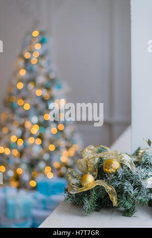 Gold and blue Christmas background of de-focused lights with decorated tree Stock Photo