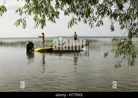 Scene mid adult female fishing hi-res stock photography and images