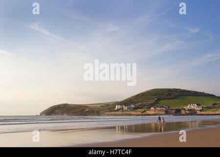 People strolling on the sand at Croyde Bay in North Devon UK Stock Photo