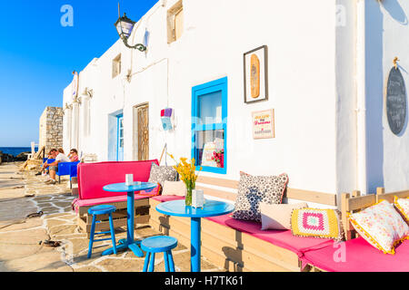 NAOUSSA TOWN, PAROS ISLAND - MAY 17, 2016: colorful Greek taverna in Naoussa port on island of Paros, Greece. Stock Photo