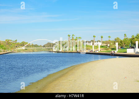 HADERA, ISRAEL - SEPTEMBER 27, 2015: View of Hadera River (Nahal Hadera) Park, the Harp (Nevel) Bridge, and visitors. Northern I Stock Photo