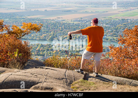 Trekker at the top of Dieppe cliff on Mont Saint-Hilaire in Quebec Stock Photo