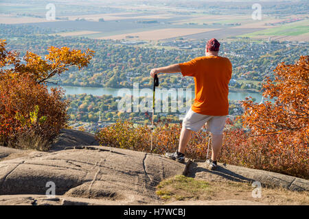 Trekker at the top of Dieppe cliff on Mont Saint-Hilaire in Quebec Stock Photo