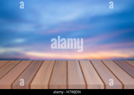 Empty top of wooden table with sunset background. For product display Stock Photo