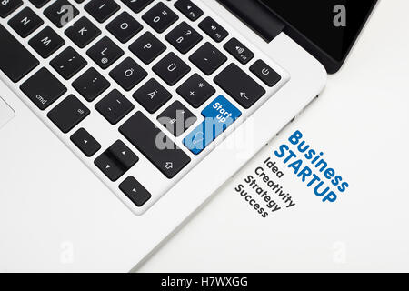 Laptop's keyboard with blue Start up key and copyspace Stock Photo