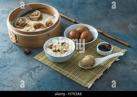 Chinese Streamed Dumpling with tea eggs and porrige Stock Photo