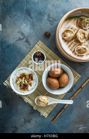 Chinese Streamed Dumpling with tea eggs and porrige Stock Photo