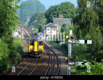 A diesel passenger train run by “Northern” approaches Parbold Station in West Lancashire Stock Photo