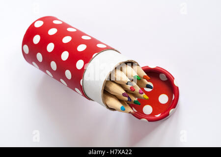 colouring pencils in red polka dots pot isolated on white background Stock Photo