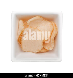 Prawn crackers in a square bowl isolated on white background Stock Photo