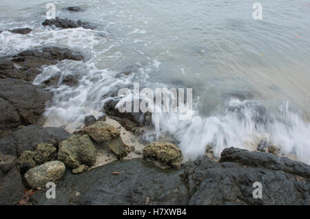 Andaman shore in Phuket, Phuket island - The effect of the waves and the rocks - long exposure photography Stock Photo