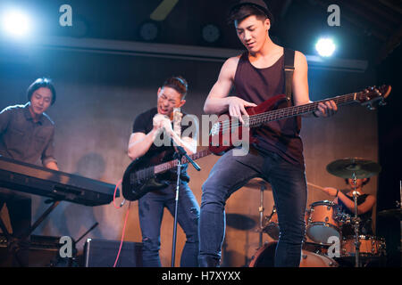 Chinese musical band performing on stage Stock Photo