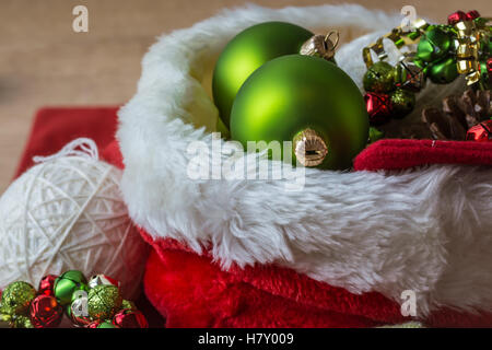 Christmas decoration setting in green, red, gold and white Stock Photo