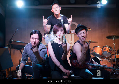 Confidence Chinese musical band on stage Stock Photo