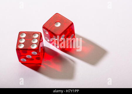 red dice against a white background Stock Photo