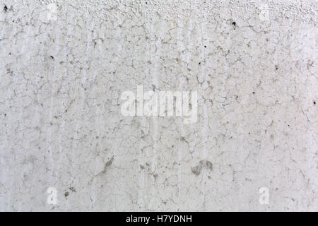 Close view of the crackled surface of smooth concrete. Stock Photo