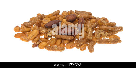 A portion of an energy trail mix blend of peanuts, almonds and sesame sticks isolated on a white background. Stock Photo