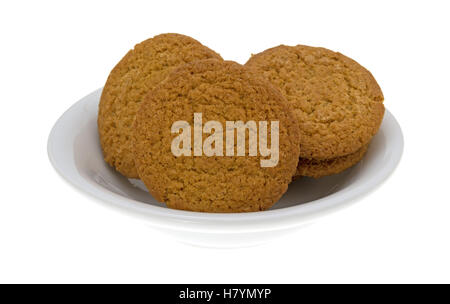 A bowl of cheesecake filled pumpkin cookies isolated on a white background Stock Photo