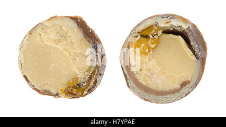 Top close view of a chocolate hazelnut cream truffle that has been sliced in half on a white background. Stock Photo