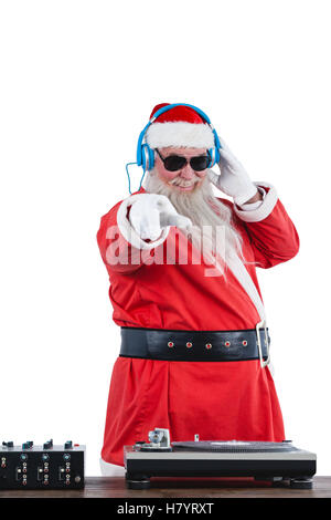 Santa claus playing a dj Stock Photo