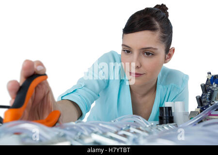 Female computer engineer repairing computer motherboard Stock Photo