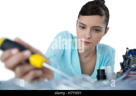 Female computer engineer repairing computer motherboard Stock Photo