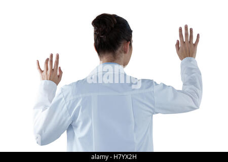 Female doctor using digital screen against white background Stock Photo