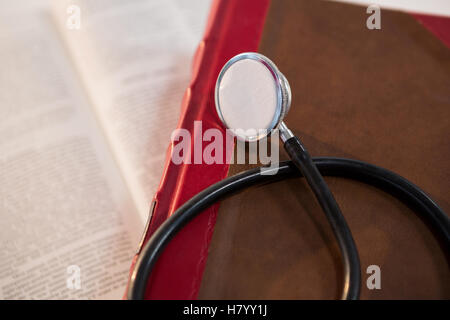 Stethoscope on open book Stock Photo