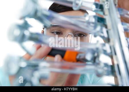Female computer engineer repairing computer motherboard Stock Photo