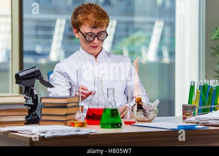 Young crazy chemist working in the lab Stock Photo