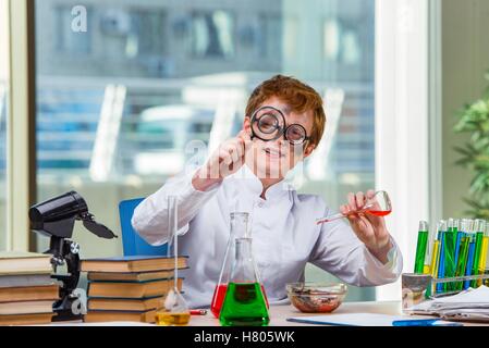 Young crazy chemist working in the lab Stock Photo