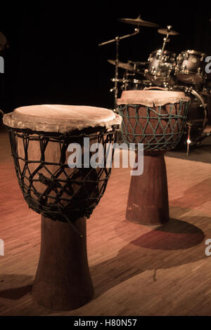 Traditional wooden african djembe drum on stage, France Stock Photo