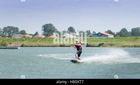 Aiguillon-sur-Mer, France, France - July 06, 2016 : installing a wake park during the 2016 season on the Lake of Aiguillon sur M Stock Photo